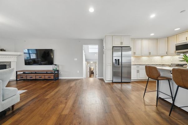 Fireplace, Interior, Kitchen, Recessed Lighting, Stainless Steel Appliances, Wood Texture Flooring