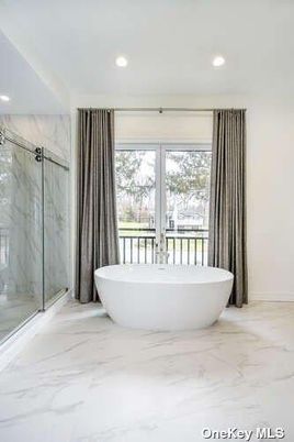 Bathroom, Free Standing Baths, Glass Shower, Interior, Marble, Marble Walls, Recessed Lighting