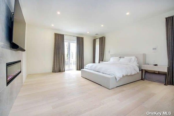 Bedroom, Fireplace, Interior, Recessed Lighting, Wood Texture Flooring