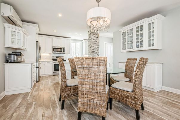Chandelier, Dining room, Interior, Kitchen, Recessed Lighting, Stainless Steel Appliances, Wood Texture Flooring