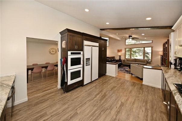 Dining room, Interior, Kitchen, Living room, Recessed Lighting, Stainless Steel Appliances, Wood Texture Flooring