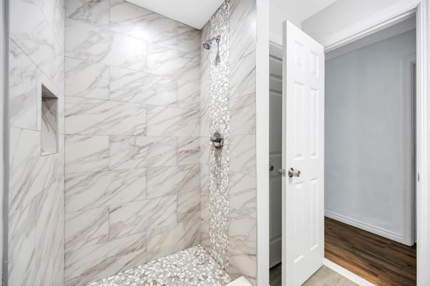 Bathroom, Glass Shower, Interior, Marble Walls, Wood Texture Flooring