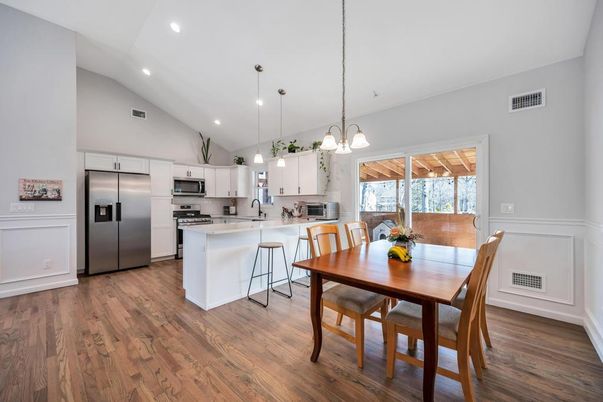 Dining room, Interior, Kitchen, Pendant Lights, Recessed Lighting, Stainless Steel Appliances, Wood Texture Flooring