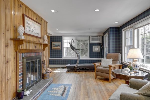 Fireplace, Fitness Equipment, Interior, Living room, Recessed Lighting, Wood Texture Flooring, Wooden Walls
