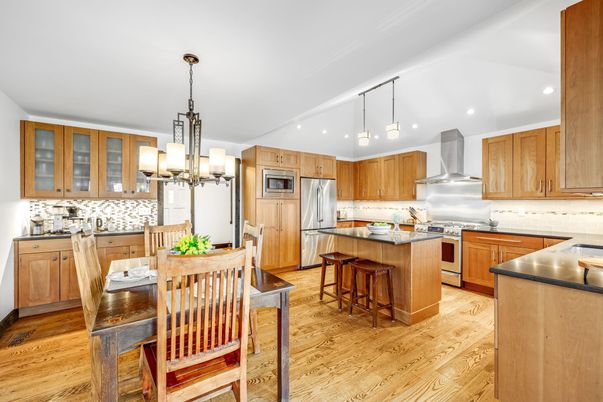 Chandelier, Dining room, Interior, Kitchen, Pendant Lights, Recessed Lighting, Stainless Steel Appliances, Wood Texture Flooring