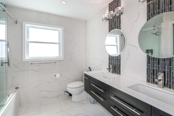 Bathroom, Dual Sink Vanities, Glass Shower, Interior, Marble, Marble Walls, Recessed Lighting
