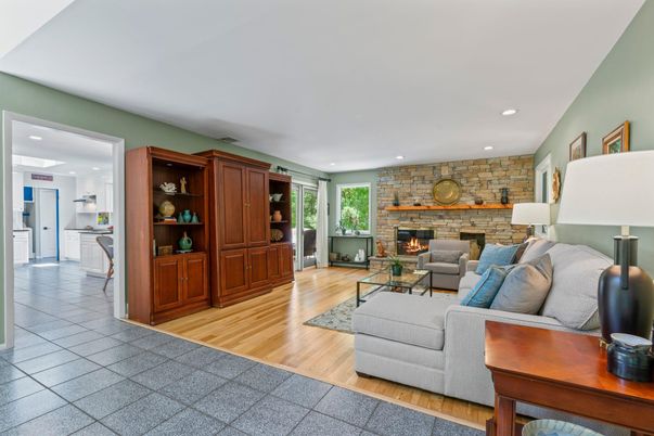 Fireplace, Interior, Living room, Recessed Lighting, Stone Walls, Wood Texture Flooring