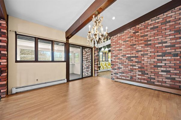 Chandelier, Empty room, Interior, Recessed Lighting, Stone Walls, Wooden Beams, Wood Texture Flooring
