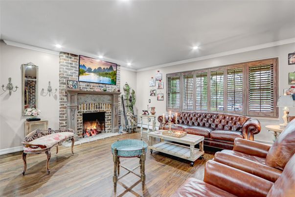 Fireplace, Interior, Living room, Recessed Lighting, Stone Walls, Wood Texture Flooring