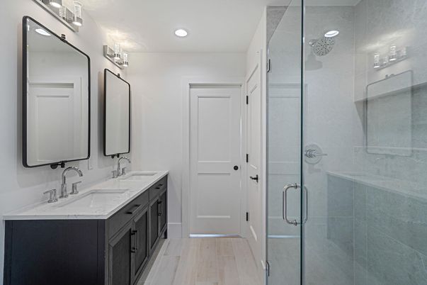 Bathroom, Dual Sink Vanities, Glass Shower, Interior, Recessed Lighting, Wood Texture Flooring