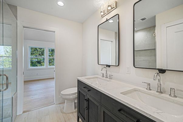 Bathroom, Dual Sink Vanities, Glass Shower, Interior, Recessed Lighting, Wood Texture Flooring