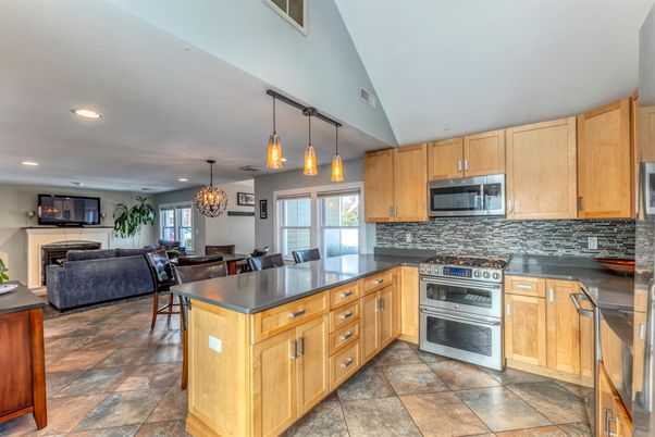 Chandelier, Dining room, Interior, Kitchen, Living room, Pendant Lights, Recessed Lighting, Stainless Steel Appliances