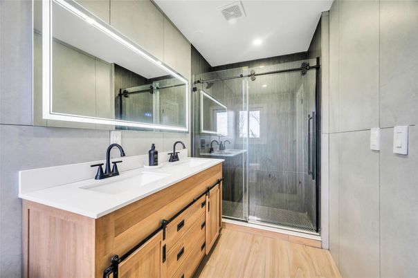 Bathroom, Dual Sink Vanities, Glass Shower, Interior, Recessed Lighting, Wood Texture Flooring
