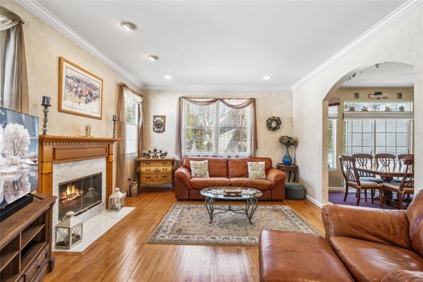 Dining room, Fireplace, Interior, Living room, Recessed Lighting, Wood Texture Flooring