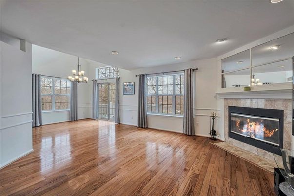 Chandelier, Empty room, Fireplace, Interior, Recessed Lighting, Wood Texture Flooring