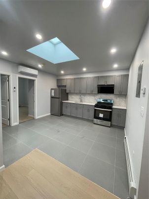 Interior, Kitchen, Marble Walls, Recessed Lighting, Stainless Steel Appliances