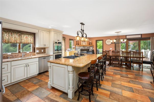 Chandelier, Dining room, Fireplace, Interior, Kitchen, Recessed Lighting, Stainless Steel Appliances