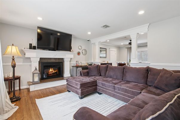 Dining room, Fireplace, Interior, Living room, Recessed Lighting, Wood Texture Flooring