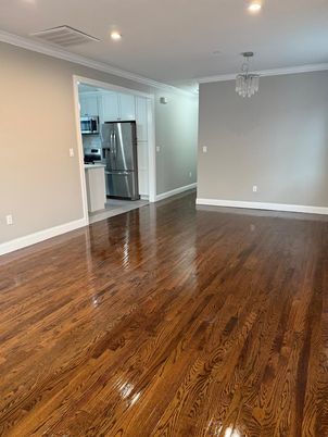 Empty room, Interior, Kitchen, Recessed Lighting, Stainless Steel Appliances, Wood Texture Flooring