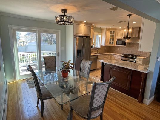Chandelier, Dining room, Interior, Kitchen, Pendant Lights, Recessed Lighting, Stainless Steel Appliances, Wood Texture Flooring