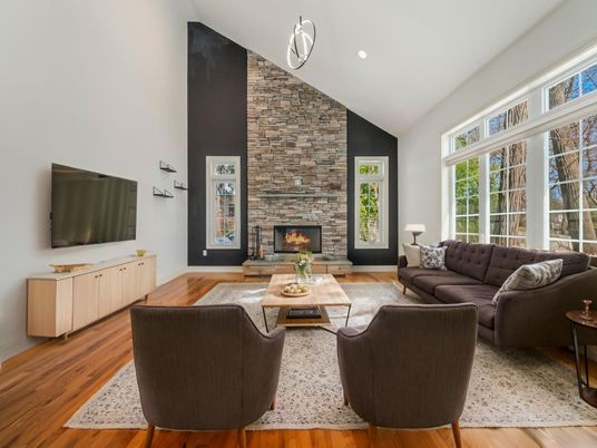 Fireplace, Interior, Living room, Recessed Lighting, Stone Walls, Wood Texture Flooring