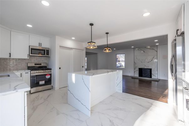Interior, Kitchen, Marble, Marble Walls, Pendant Lights, Recessed Lighting, Stainless Steel Appliances
