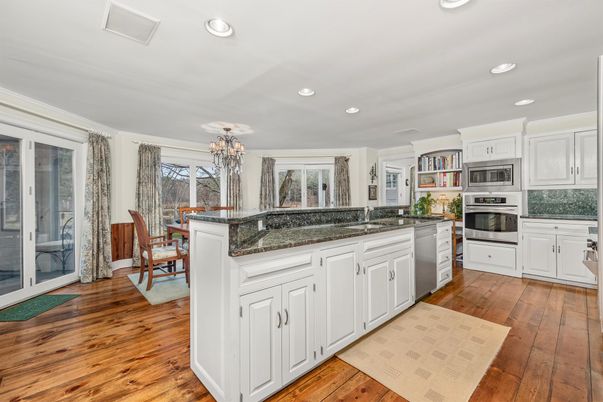 Chandelier, Dining room, Interior, Kitchen, Recessed Lighting, Stainless Steel Appliances, Wood Texture Flooring