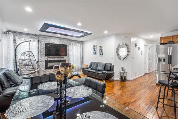 Fireplace, Interior, Kitchen, Living room, Recessed Lighting, Stainless Steel Appliances, Stone Walls, Wood Texture Flooring