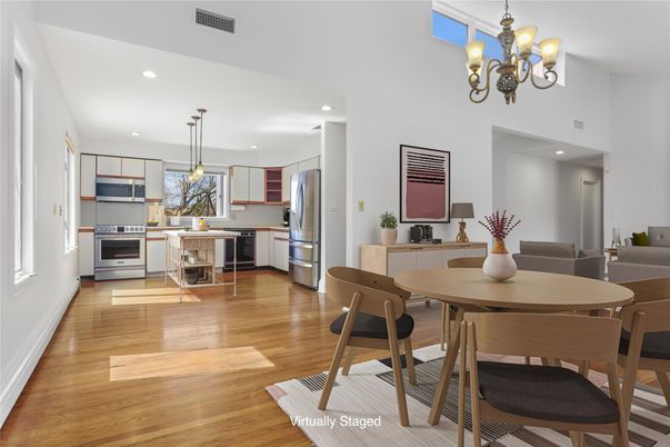 Chandelier, Dining room, Interior, Kitchen, Pendant Lights, Recessed Lighting, Stainless Steel Appliances, Wood Texture Flooring