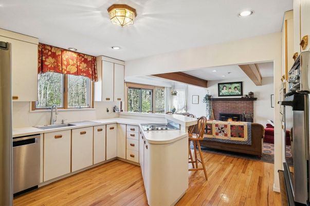 Fireplace, Interior, Kitchen, Recessed Lighting, Stainless Steel Appliances, Stone Walls, Wooden Beams, Wood Texture Flooring
