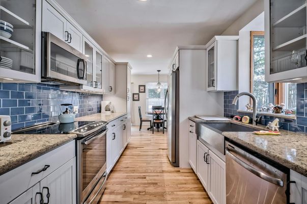 Dining room, Interior, Kitchen, Pendant Lights, Recessed Lighting, Stainless Steel Appliances, Wood Texture Flooring