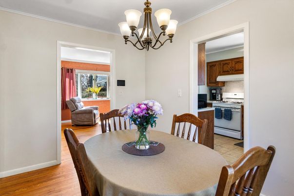 Chandelier, Dining room, Interior, Kitchen, Stainless Steel Appliances, Wood Texture Flooring