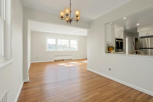 Chandelier, Empty room, Interior, Kitchen, Recessed Lighting, Stainless Steel Appliances, Wood Texture Flooring