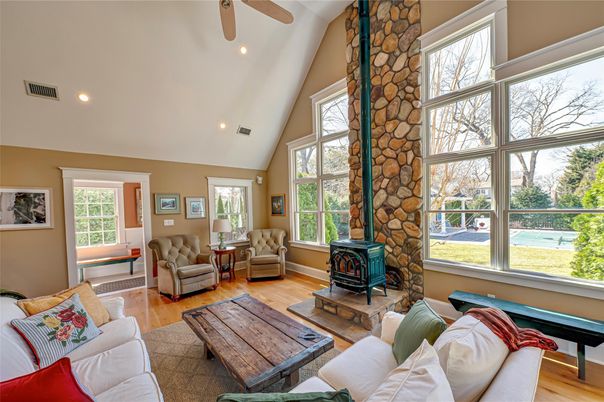 Fireplace, Interior, Living room, Recessed Lighting, Stone Walls, Wood Texture Flooring