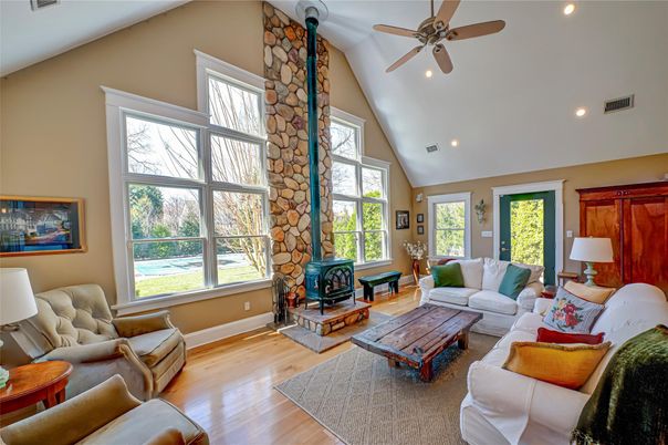 Fireplace, Interior, Living room, Recessed Lighting, Stone Walls, Wood Texture Flooring