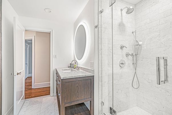 Bathroom, Glass Shower, Interior, Marble, Marble Walls, Recessed Lighting, Wood Texture Flooring