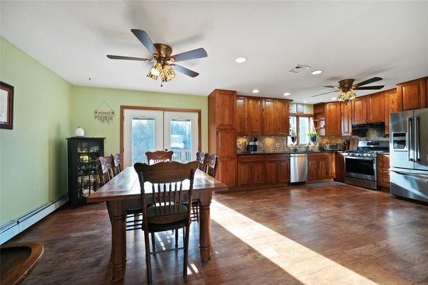 Dining room, Interior, Kitchen, Recessed Lighting, Stainless Steel Appliances, Wood Texture Flooring