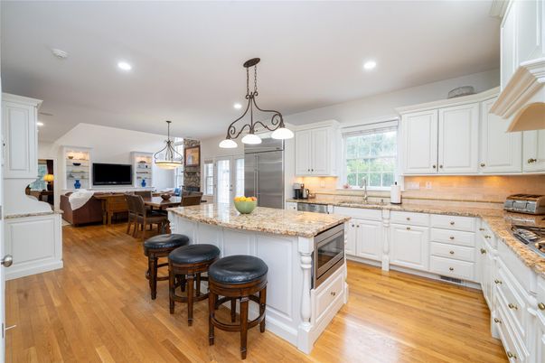 Chandelier, Dining room, Interior, Kitchen, Pendant Lights, Recessed Lighting, Stainless Steel Appliances, Wood Texture Flooring