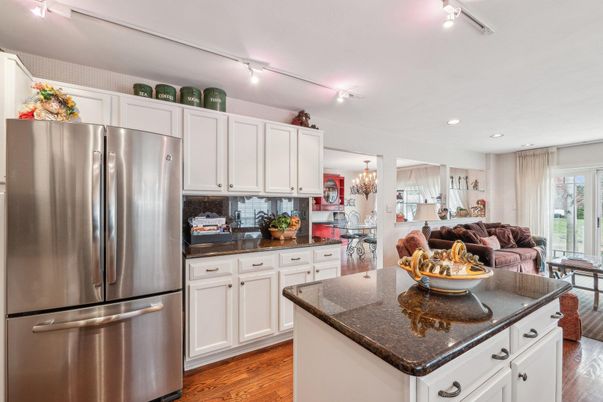 Chandelier, Dining room, Interior, Kitchen, Recessed Lighting, Stainless Steel Appliances, Wood Texture Flooring