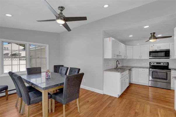 Dining room, Interior, Kitchen, Recessed Lighting, Stainless Steel Appliances, Wood Texture Flooring