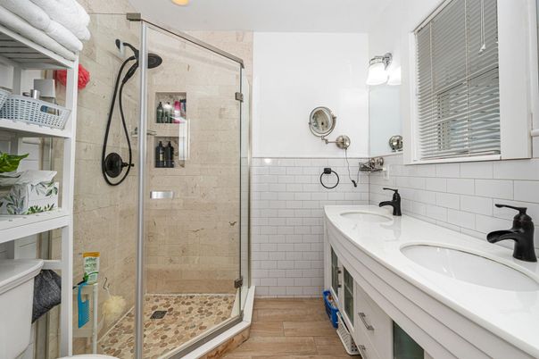 Bathroom, Dual Sink Vanities, Glass Shower, Interior, Recessed Lighting, Wood Texture Flooring