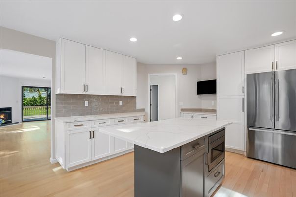 Fireplace, Interior, Kitchen, Recessed Lighting, Stainless Steel Appliances, Wood Texture Flooring