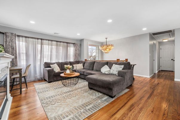 Chandelier, Dining room, Fireplace, Interior, Living room, Recessed Lighting, Wood Texture Flooring