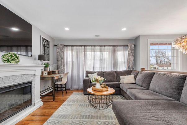 Chandelier, Fireplace, Interior, Living room, Recessed Lighting, Wood Texture Flooring