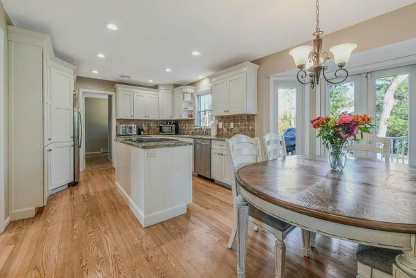 Chandelier, Dining room, Interior, Kitchen, Pendant Lights, Recessed Lighting, Stainless Steel Appliances, Wood Texture Flooring