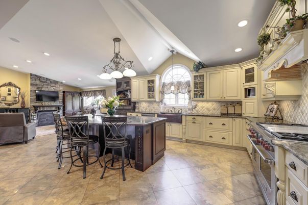 Fireplace, Interior, Kitchen, Living room, Pendant Lights, Recessed Lighting, Stainless Steel Appliances, Stone Walls
