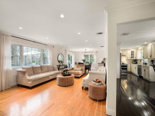 Chandelier, Dining room, Interior, Kitchen, Living room, Pendant Lights, Recessed Lighting, Stainless Steel Appliances, Wood Texture Flooring