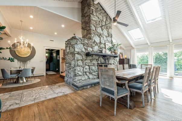 Dining room, Fireplace, Interior, Recessed Lighting, Stone Walls, Wood Texture Flooring