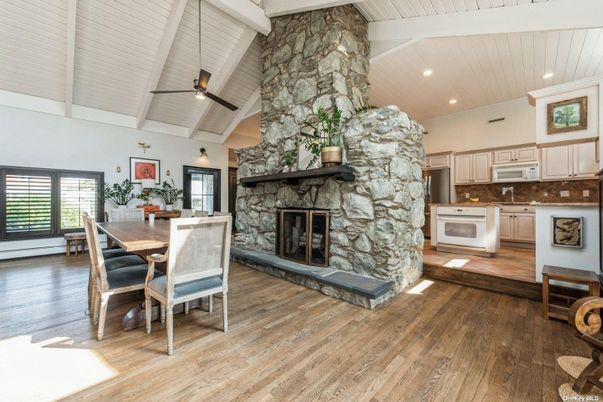 Dining room, Fireplace, Interior, Kitchen, Recessed Lighting, Stone Walls, Wood Texture Flooring