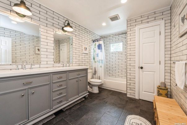 Bathroom, Dual Sink Vanities, Interior, Recessed Lighting, Stone Walls